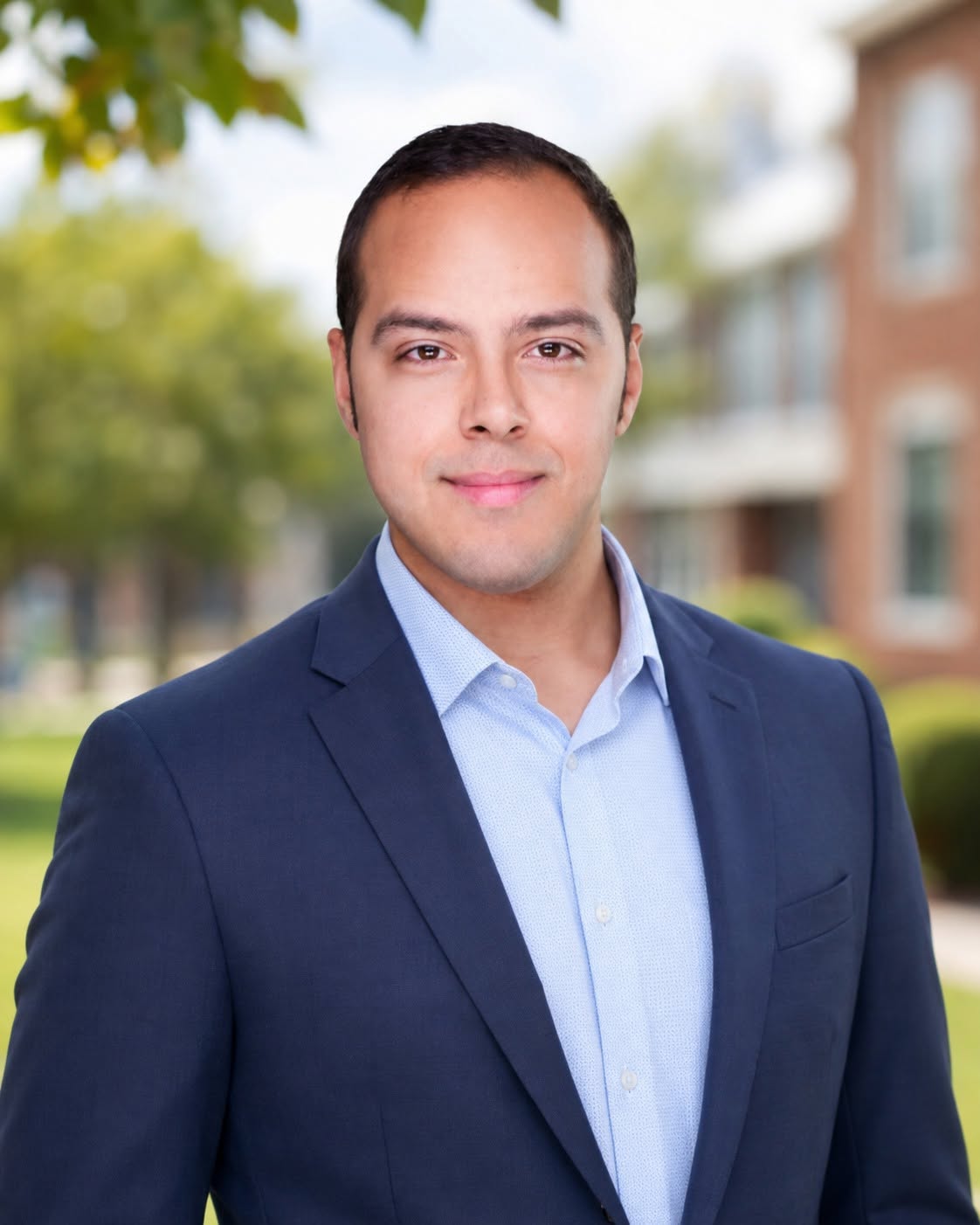 Matthew Matias in front of a school campus